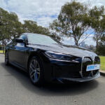 BMW i4 eDrive35 side view Origin Energy summer promo