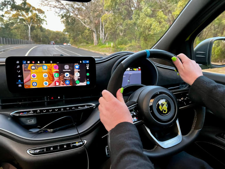 Fiat Abarth 500e inside driving